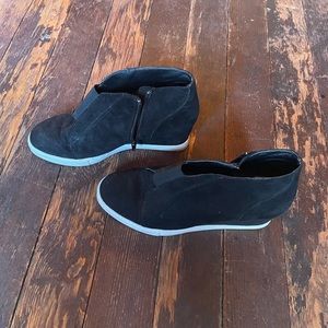 Black platform sneakers.